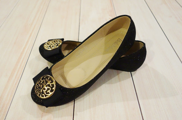 black flats with gold trim