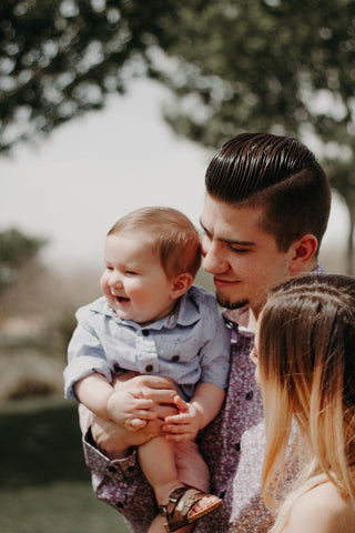 Family time happy smiles with baby mum and dad