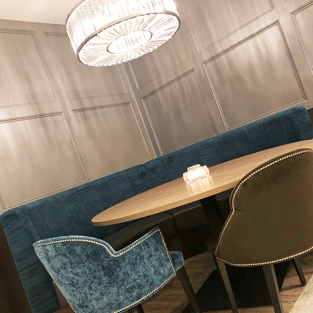 Teal velvet round booth seating