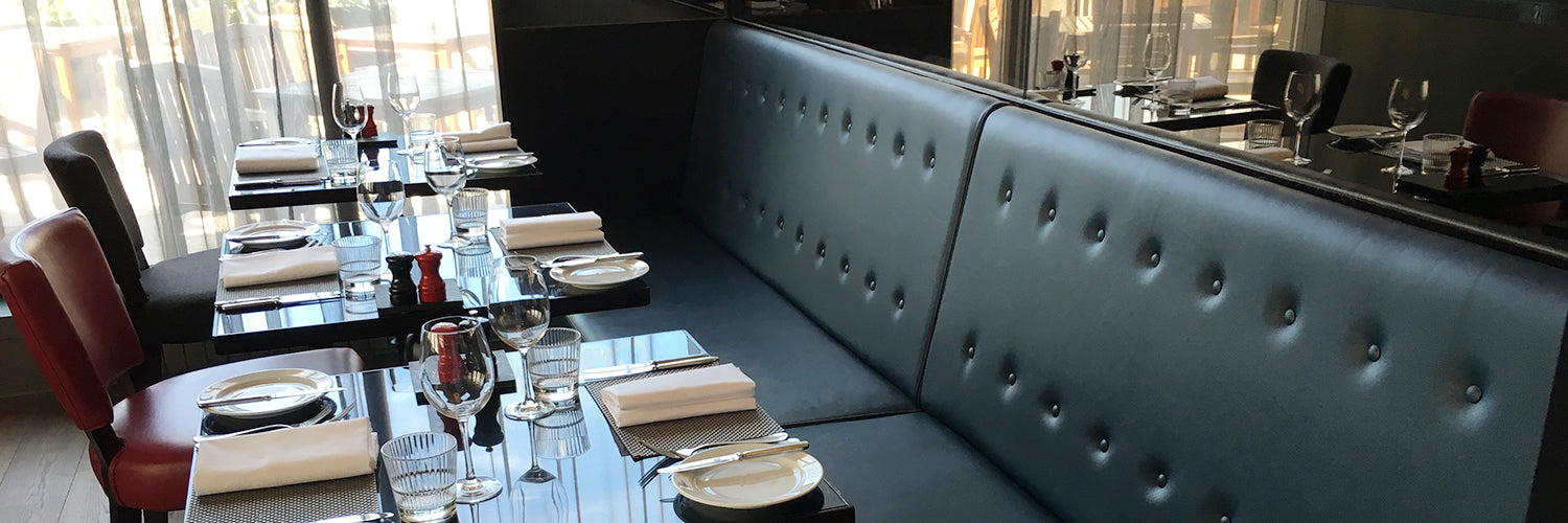 Dark Green Banquette Seating next to Restaurant Table