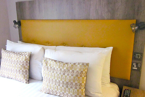 yellow-faux-leather-hotel-upholstered-headboard-with-button-detail