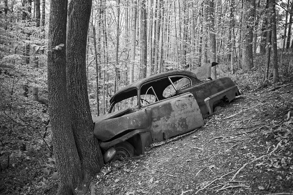 Wrecked Antique Car Found in the Woods: Black and White Photograph by Keith Dotson. Click to buy a photograph.