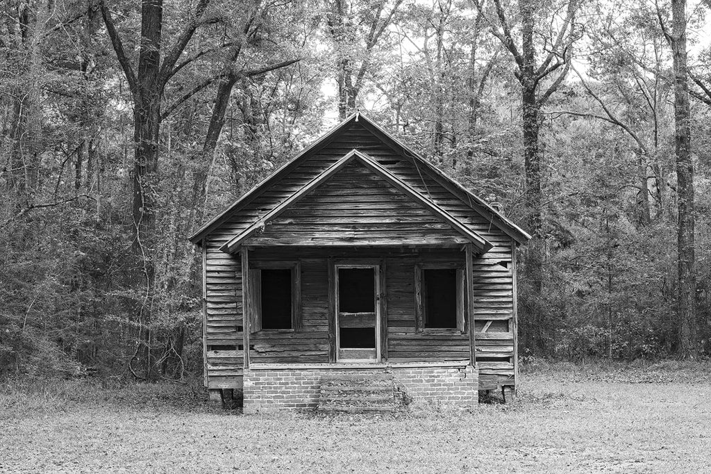 Abandoned wooden schoolhouse in the forest. Click to buy a fine art photograph.