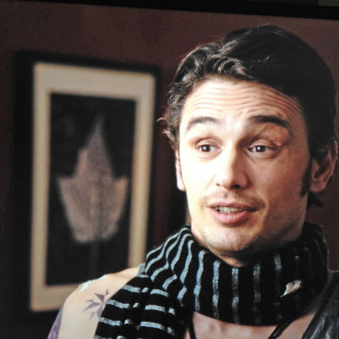 Actor James Franco with one of Keith's leaf photographs over shoulder in a scene from the movie "Why Him?".