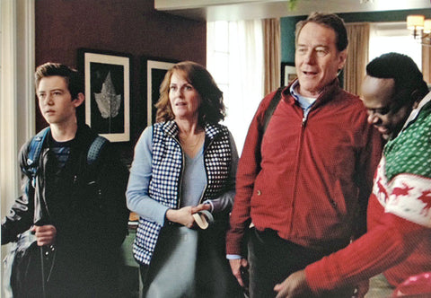 Some of the cast of "Why Him?" on the set with two photographs by Keith Dotson. Pictured here are Griffin Gluck, Megan Mullally, Bryan Cranston, and Cedric the Entertainer.