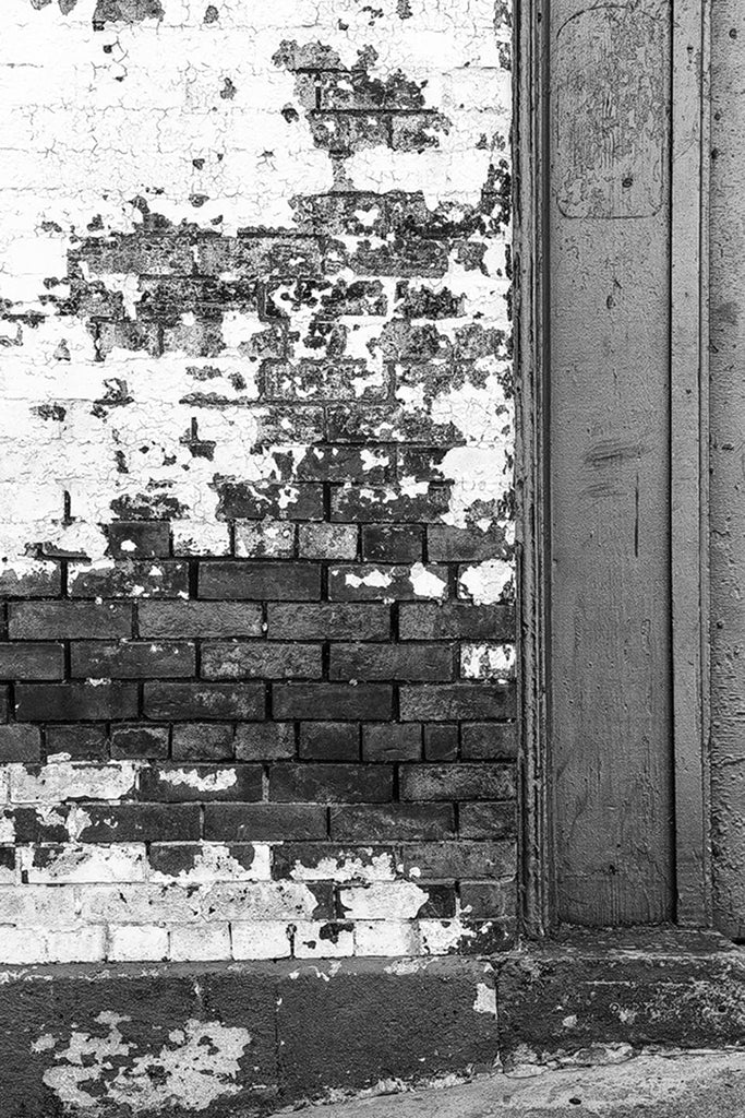 Exterior brick detail of the old Acme Farm Supply Building, black and white photo by Keith Dotson.