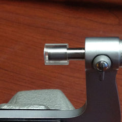 Slip a short piece of 1/4" ID hose over the mic spindle