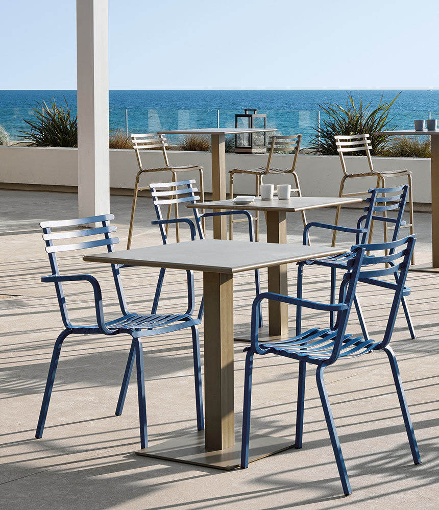 Ethimo Flower Pedestal Dining Table and Dining Chairs on Outdoor Deck