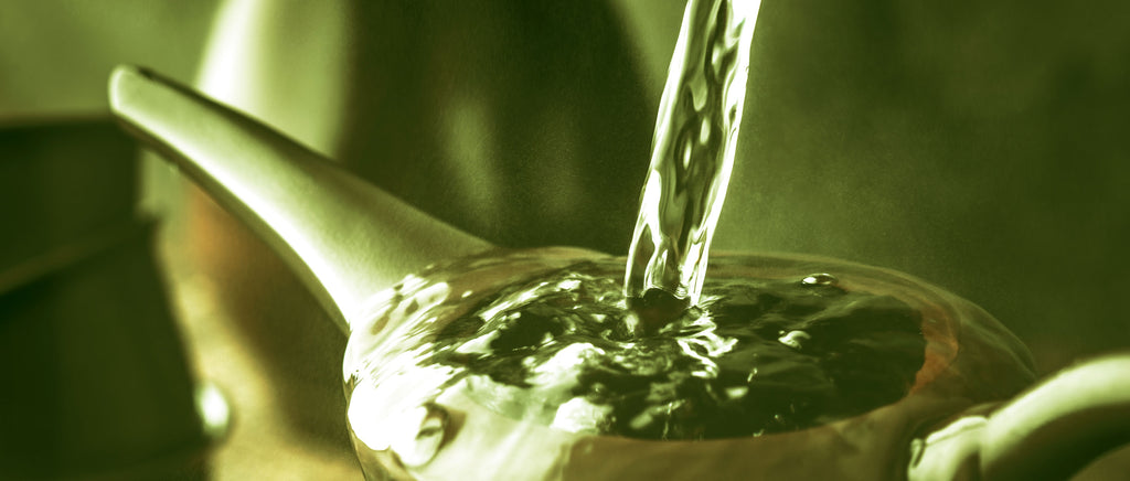 Green tea pouring