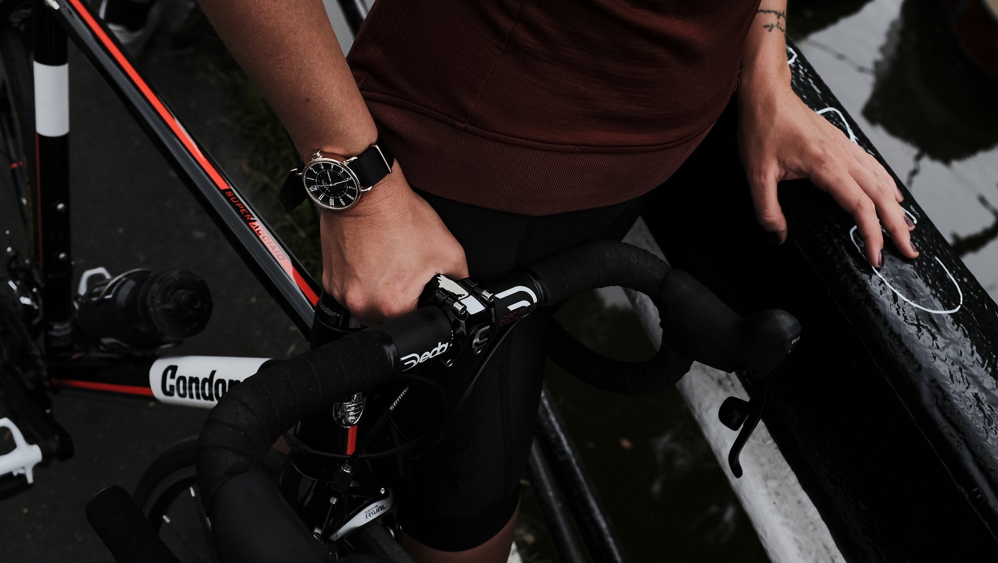 Person on bike wearing No.88 Camden x KPP watch