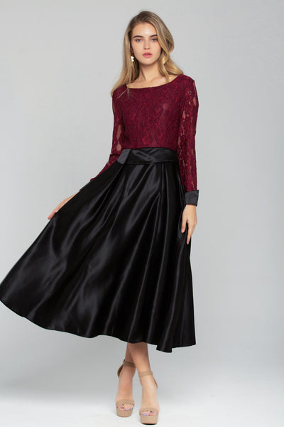 maroon top with black skirt