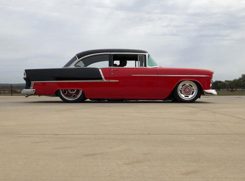 Customs and Hot Rods of Andice builds coach-built cars, custom hot rods, performance builds, and restores classic cars. This is a profile shot of Harold's black and red 1955 Chevrolet Bel Air.