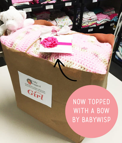 gently hugged bag topped with baby wisp bow