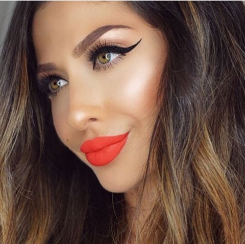 winged liner love story lashes red lips 