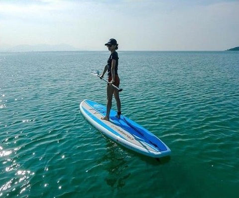 Having fun on a non-inflatable stand up paddle board