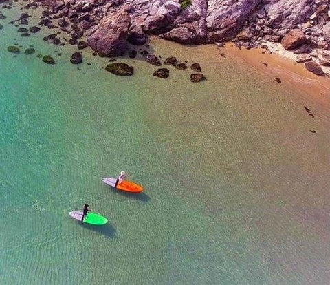 Stand up paddle boarders enjoying calm water