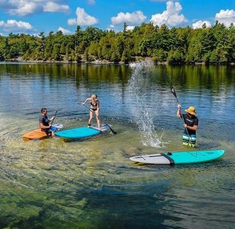 stand up paddle boarding on a lake on epoxy stand up paddle boards