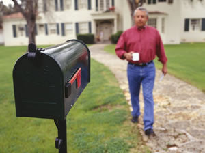 Man Getting the Mail with a Coffee