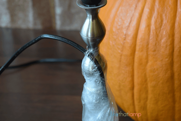 How to Upcycle an IKEA Lamp into a Floral Pumpkin Centerpiece Lamp - See the full DIY tutorial at www.ilikethatlamp.com