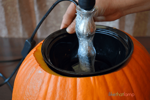 How to Upcycle an IKEA Lamp into a Floral Pumpkin Centerpiece Lamp - See the full DIY tutorial at www.ilikethatlamp.com