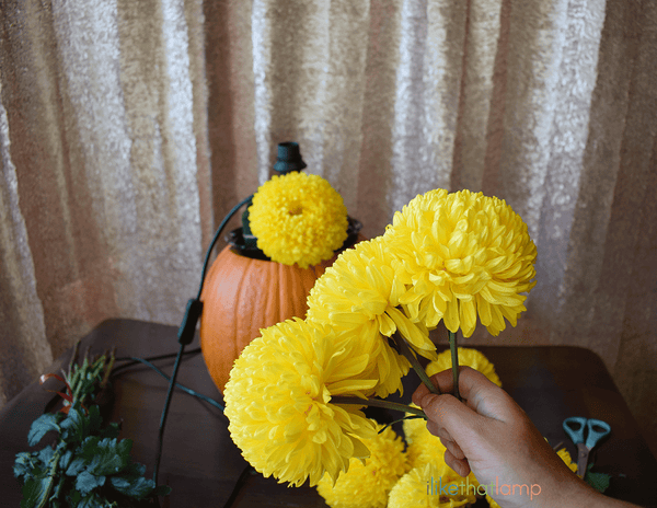 How to Upcycle an IKEA Lamp into a Floral Pumpkin Centerpiece Lamp - See the full DIY tutorial at www.ilikethatlamp.com