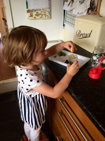 Mouse making her kid friendly fruit infusing recipe