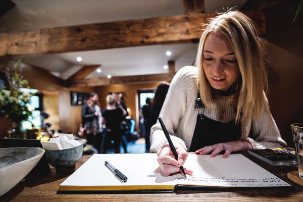 katie signing the visitors book