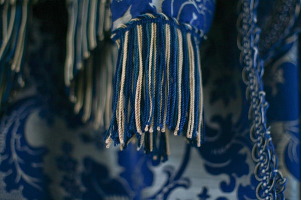 Fringe on a valuable antique textile sold by Pandora de Balthazar. 