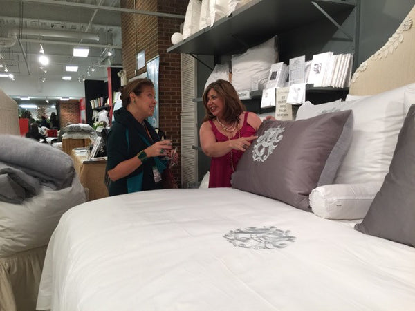 Toma Clark Haines shows off her custom monogrammed bedding.