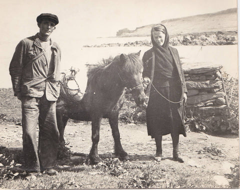 My Great Aunty Betty wearing a hap with Norwick beach in the background
