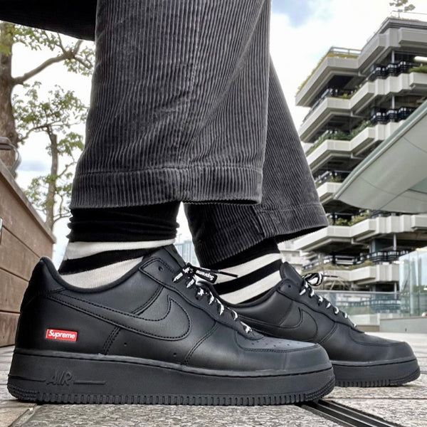 black supreme air force 1 on feet