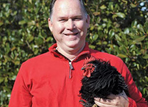 Jeffrey Williams with a chicken