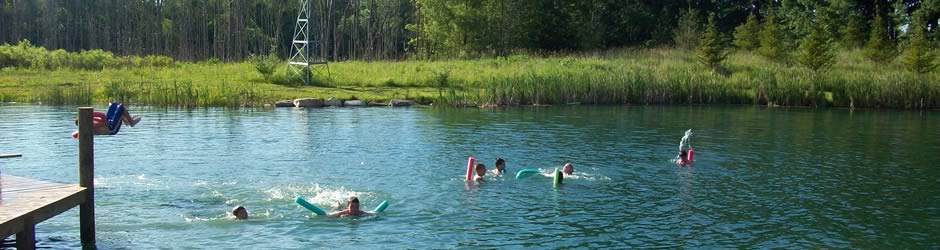 Kids playing in a pond