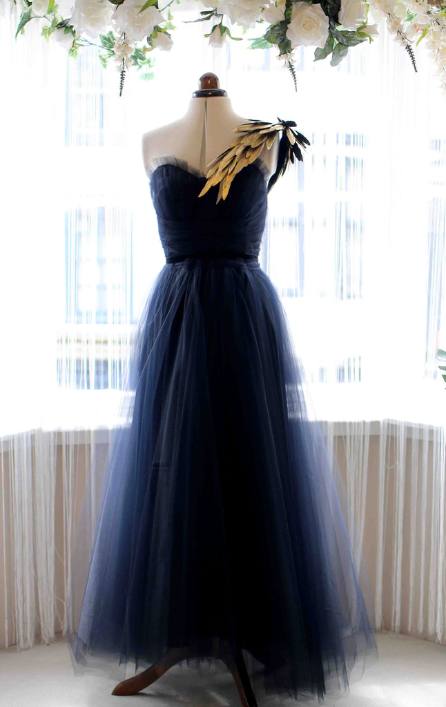 black and gold feather ballgown by Alexandra King