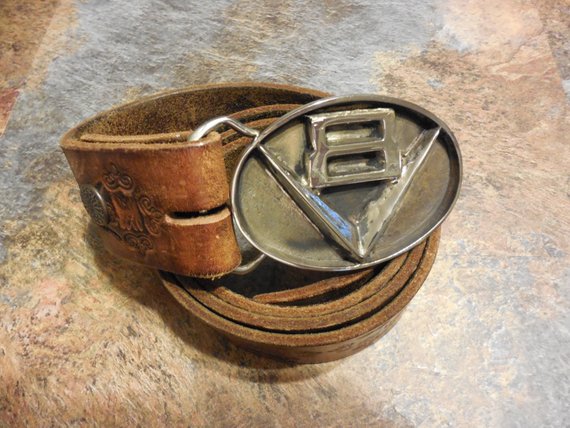 v8 belt buckle