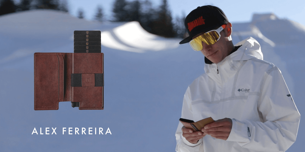Image of Alex Ferreira using his smart wallet in the slopes, with an image of the tracker wallet superimposed next to him.