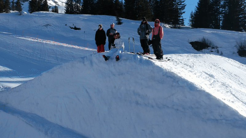 Animated gif of the skiers from the shoot; one of them throws a snowball at the camera, which veers to the right in response.