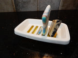 Plastic soap dish with samples