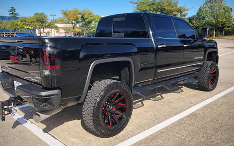 Lifted truck with side steps by Spyder Industries