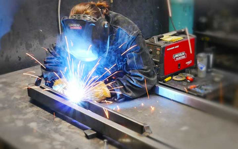 Welding a steel headache rack at Spyder Industries