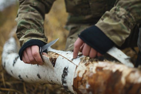 Using a Survival Knife to scrape bark