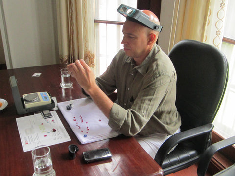 Dmitry inspecting rubies in Burma
