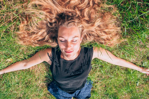 Woman sleeping on ground