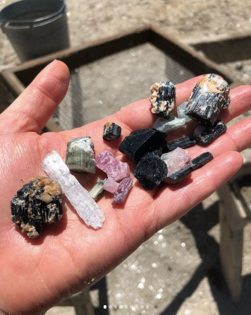 Variety of crystals in hand