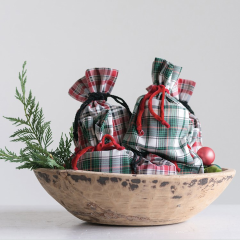 spruce candle in plaid bag