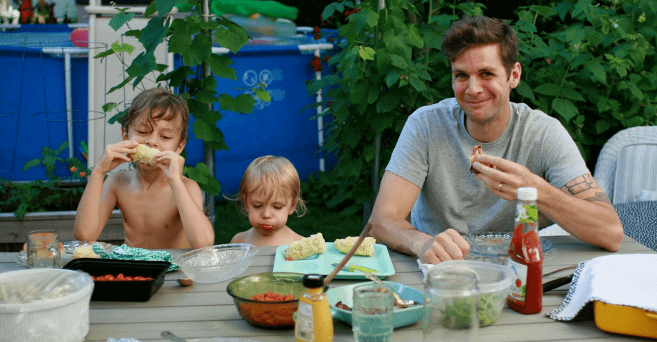 artist joseph conrad ferm at picnic table with kids