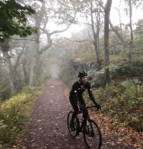 joseph ferm in mens leggings riding bike in woods