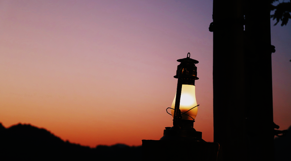 Lantern against setting sun sunset