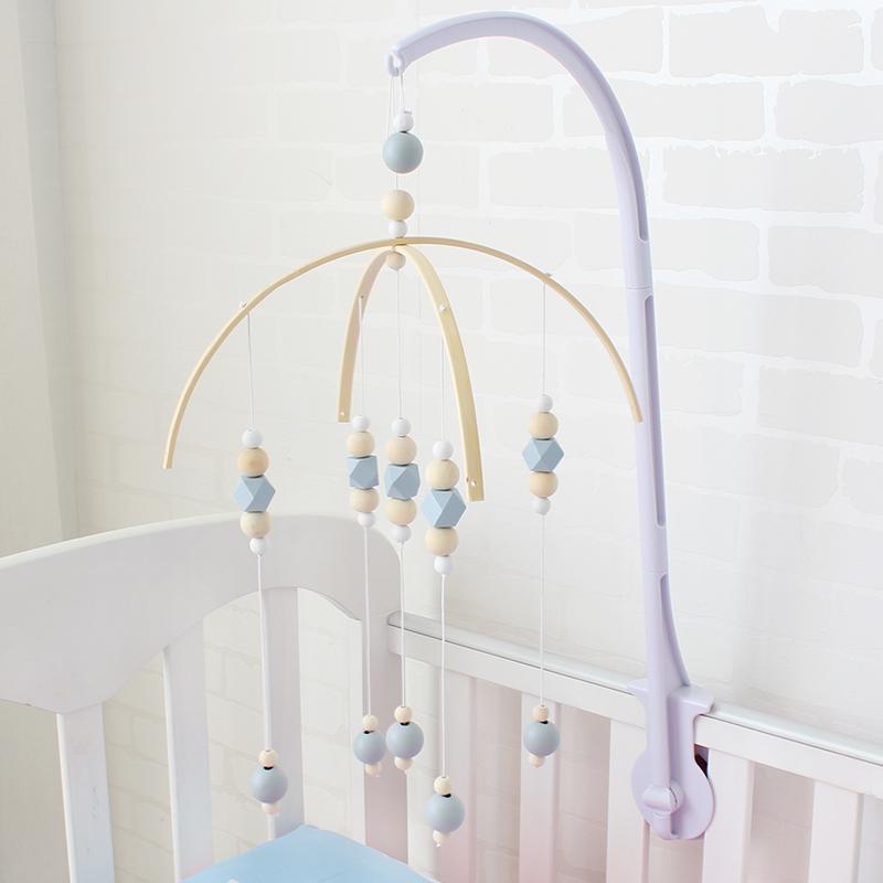 grey and yellow cot mobile