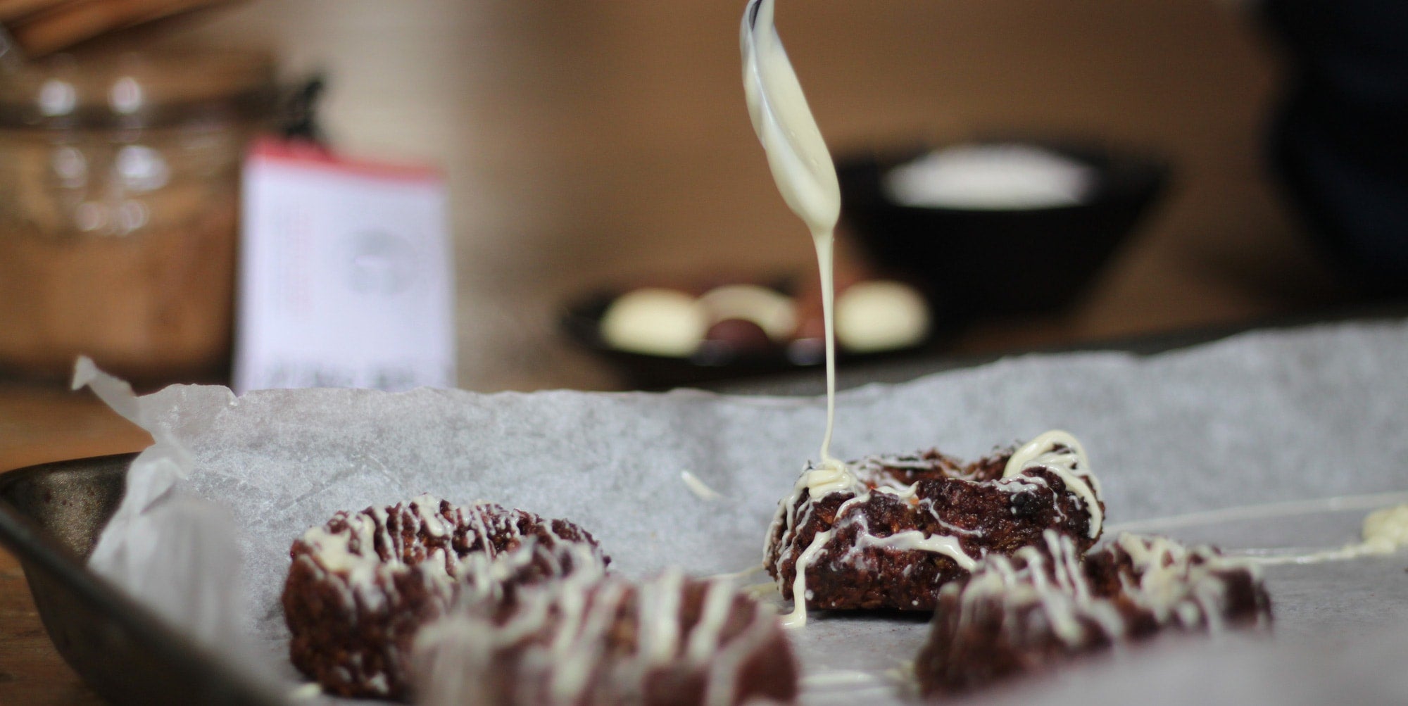 drizzling macaroon nests with chocolate